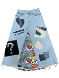 “Falda Hilena de denim reciclado con pedrería, frase pintada a mano y parche de lentejuelas reversibles.”